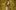 Renee_Fleming_credit_Andrew Eccles_Decca Fleming wearing a sparkly gold coat with a gold feathered collar, posing in front of a gold painted background with visible brush strokes.