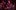 2024-12-03-Big-Bands In a purple and pink hue, a baritone saxophonist plays into a microphone. She has shoulder-length red hair and wears a black and white suit jacket.