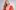 25-26-Event-Page-Website-Image-2-aspect-ratio-613-378 Raiatea Helm in a red dress and long beaded necklaces with her guitar.