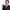 Pedro Sánchez Pedro Sánchez holding his cello and smiling while looking off camera to the right