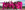 Website Cover Image Ndlovu Youth Choir members wear pink and stand together smiling with arms out